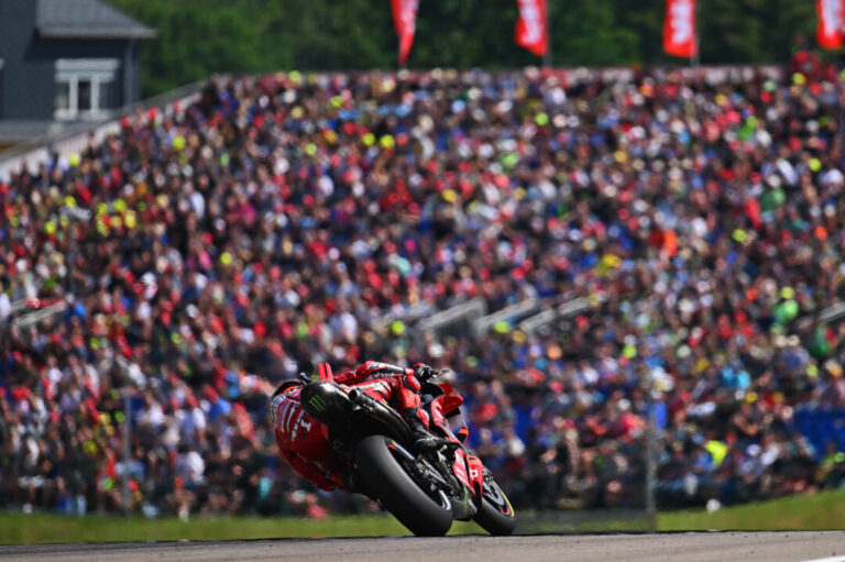 Francesco Bagnaia in front of a packed Sachsenring crowd // Photo by Lukasz Swiderek