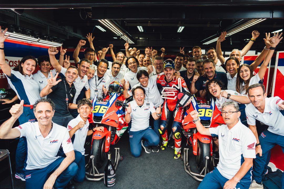 Joan Mir and the Honda factory team celebrate the Spaniard's podium finish at Motegi